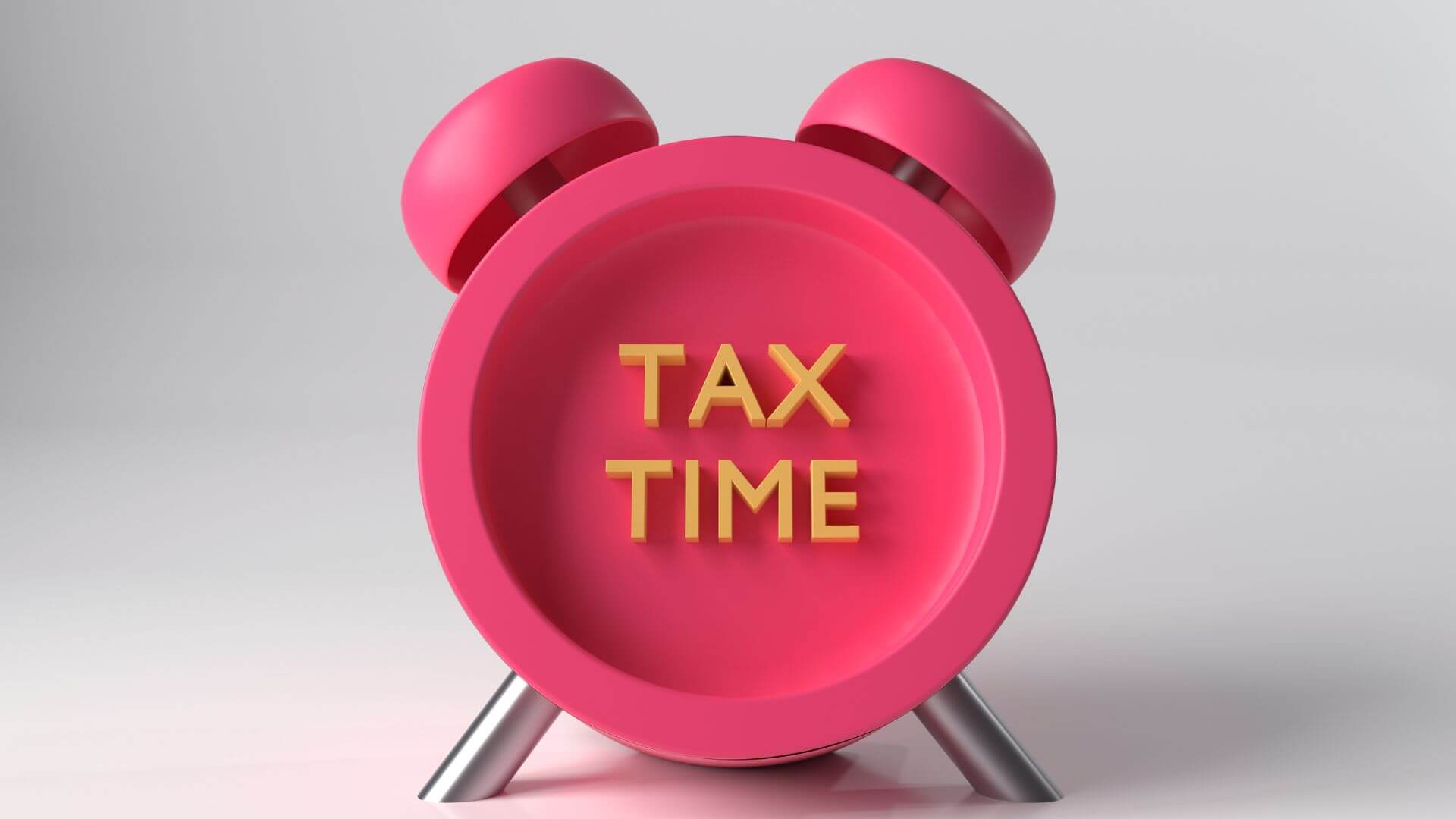 A vibrant pink alarm clock with 'TAX TIME' boldly emblazoned on its face, symbolizing the urgency and importance of tax planning for property investors.