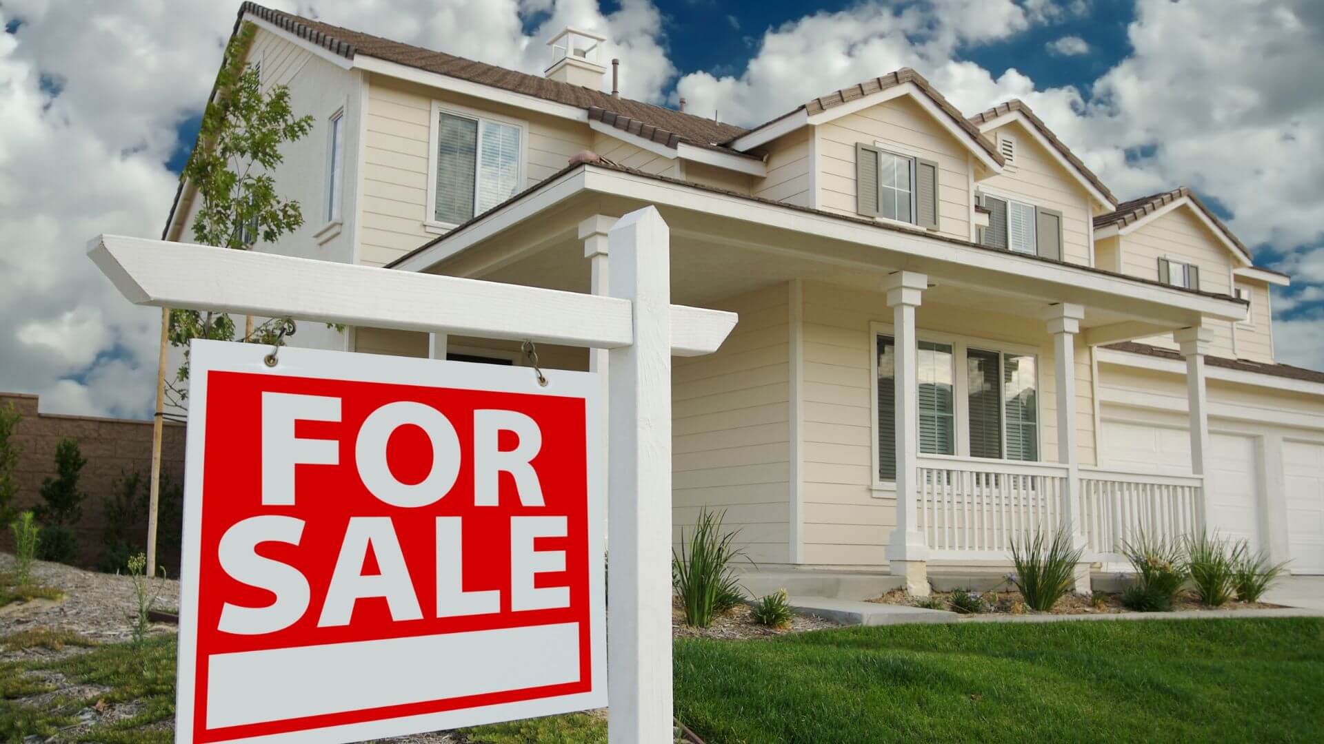 Front view of a house with a 'For Sale' sign, representing an investment property for sale in a residential suburb.