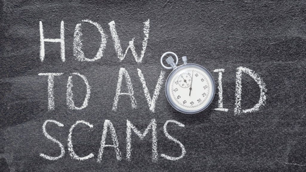 Chalkboard background with the words “How to Avoid a Rental Scam” written in white chalk and a stopwatch overlay, representing awareness and urgency in preventing rental scams.